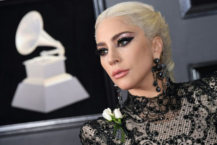 Lady Gaga wears a white rose in support of the Time's Up initiative at the Grammys.