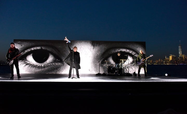 U2 performs on the Hudson River. 