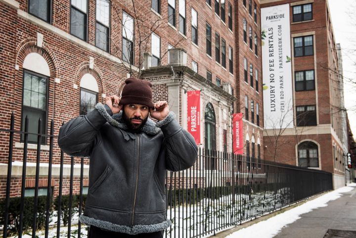 Brooklyn resident Sinaka Garcia stands in front of the hospital he was born in. Two-bedroom apartments at the former hospital, which now is a luxury building called The Parkside Brooklyn, rent for upward of $4,000.