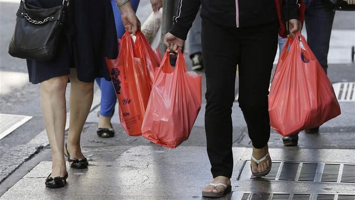 Women walk with plastic bags through Chinatown in San Francisco. Two years ago, California voters approved a statewide ban on