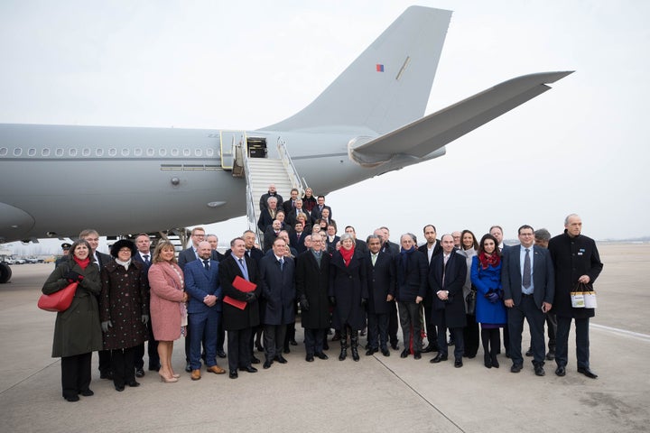 Theresa May with husband Philip and International Trade Secretary Liam Fox, after arriving in China.