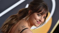 Dakota Johnson Insists She Wasn't Side-Eyeing Angelina Jolie During Jennifer Aniston Golden Globes Speech