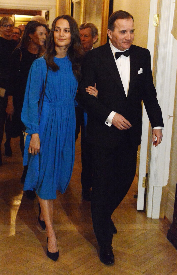 Actress Alicia Vikander escorted by Swedish Prime Minister Stefan Lofven for the dinner at the British ambassador's residence in Stockholm on Jan. 30.