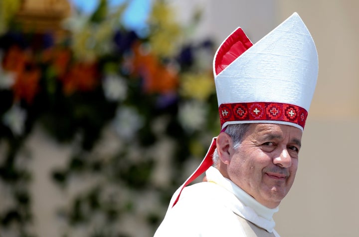 Bishop Juan Barros looks on as Pope Francis leaves at the end of a mass at the Lobito beach in Iquique, Chile, January 18, 2018.