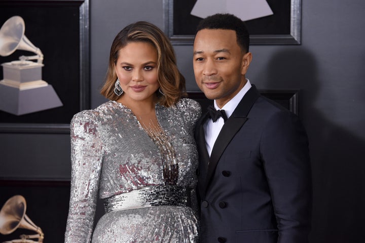 Chrissy Teigen and John Legend stun on the red carpet at the Grammys awards show.