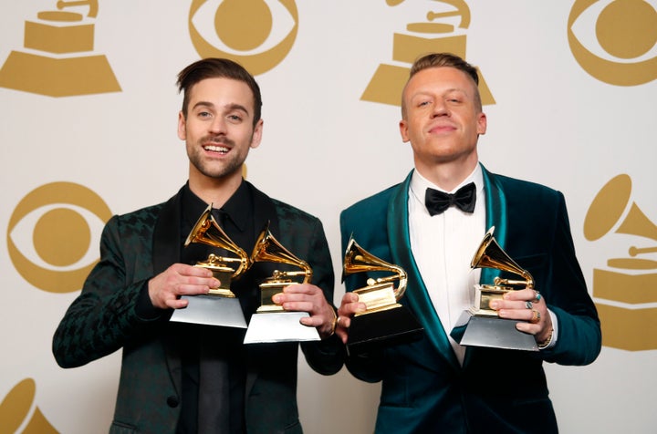 Hip-Hop artists Macklemore (R) and Ryan Lewis pose backstage with their awards.