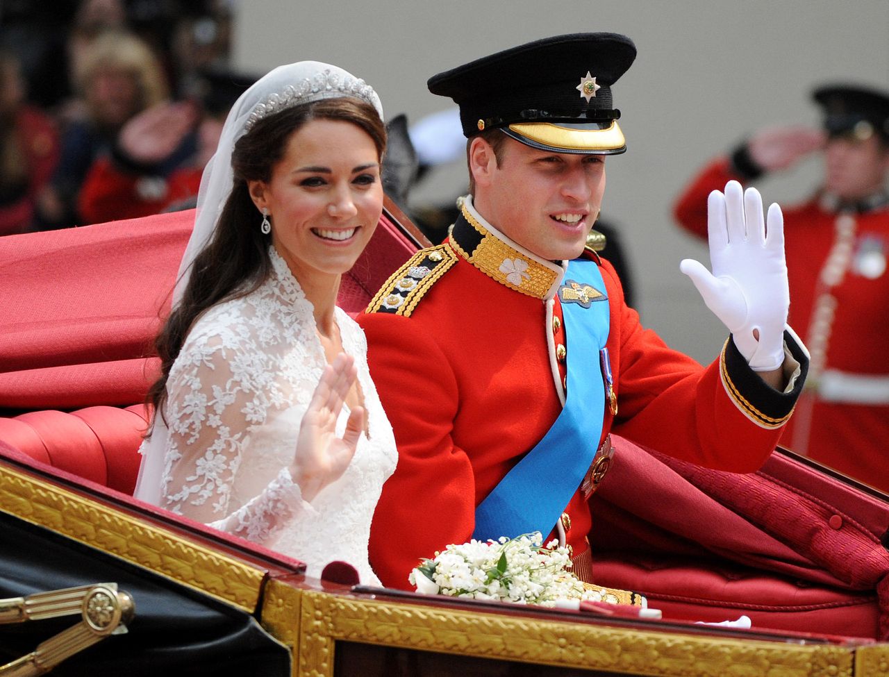 <strong>Catherine Middleton and Prince William drive down the Mall in an open carriage on their way to Buckingham Palace after their wedding ceremony at Westminster Abbey</strong>
