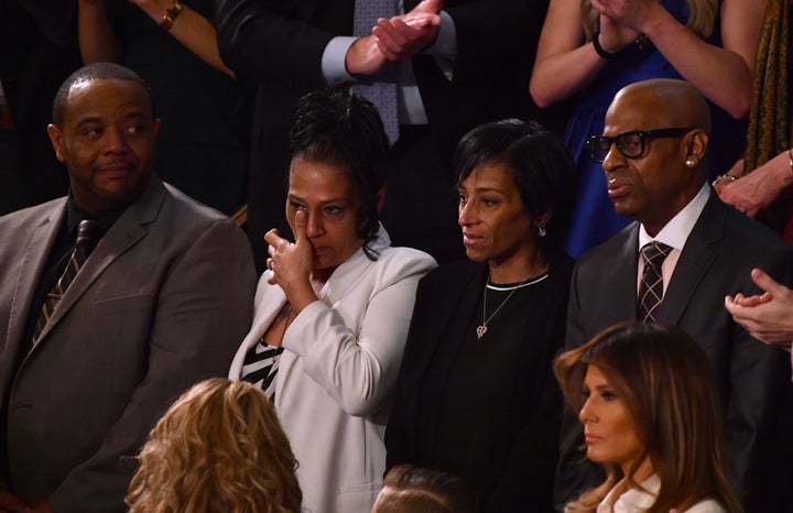 Robert Mickens, left, with his wife, Elizabeth Alvarado, who lost their daughter Nisa, sit with Evelyn Rodriguez, center, and Freddy Cuevas, who lost their daughter Kayla to gang violence, are recognized during the State of the Union address Tuesday.