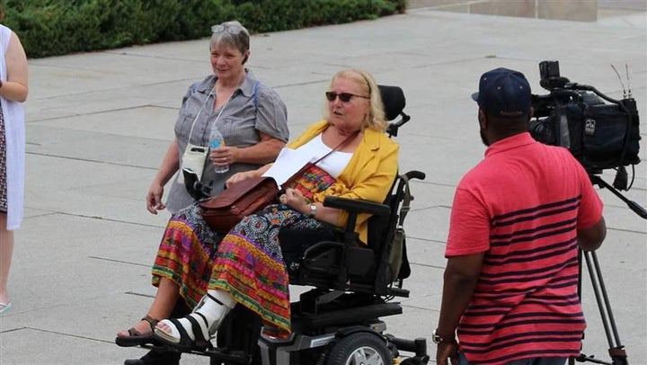 Kathy Hoell, second from left, joins another activist to advocate for disability rights at the state Capitol in Lincoln. Hoell helped Nebraska become a nationwide leader in voter access for people with disabilities.