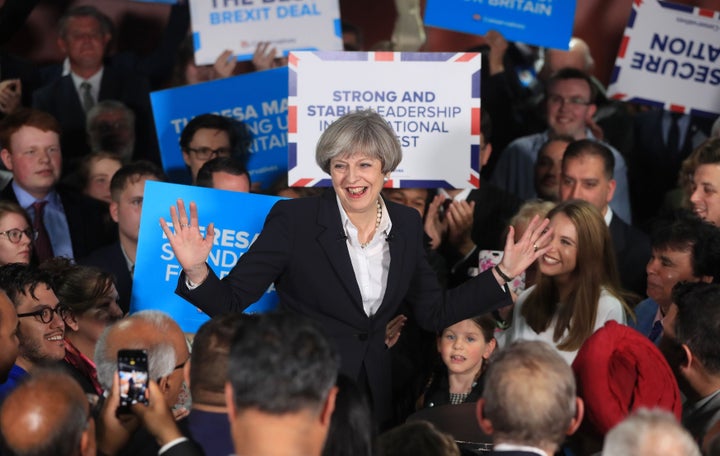 Theresa May campaigns with Tory activists during the 2017 general election.