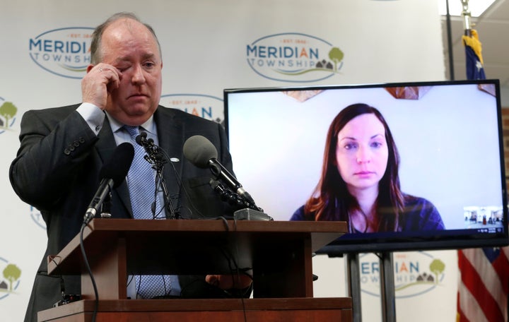 Meridian Township manager Frank Walsh apologizes to sexual assault survivor Brianne Randall-Gay (on video screen) on Feb