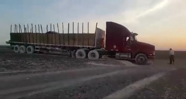 A tractor-trailer is seen parked on the site of Peru's famous Nazca Lines on Saturday after the driver took his vehicle off t