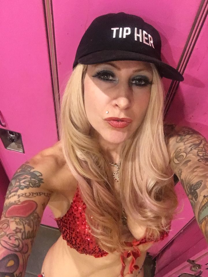 A selfie at work in a Jacq the Stripper Hat. (She has her own line: Strippersforever.com.)