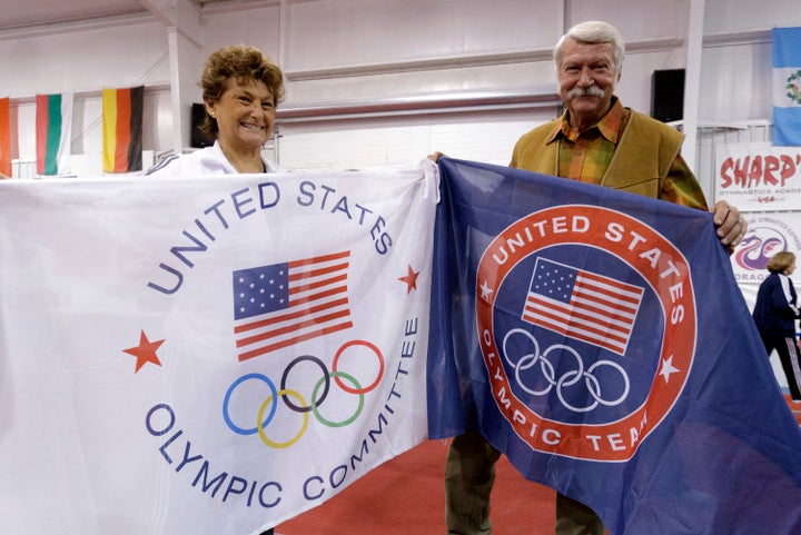 Martha and Bela Karolyi display banners at their gym, "the Ranch," to celebrate its being named an official training site for USA Gymnastics, in 2011.