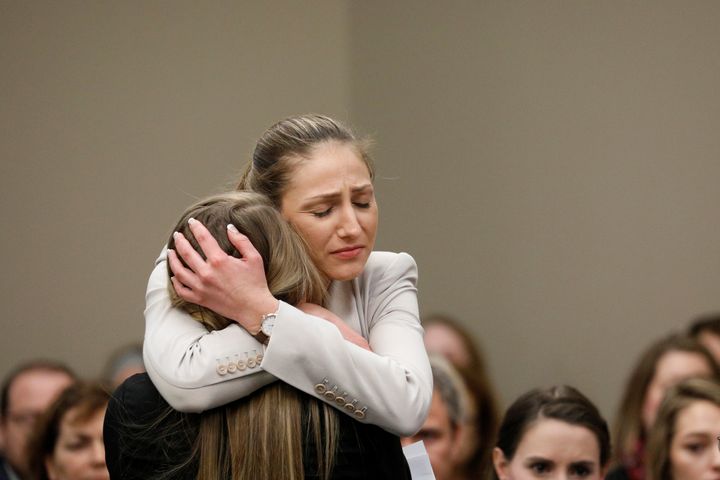 Victim Emily Morales is hugged after speaking at the sentencing hearing for Larry Nassar.