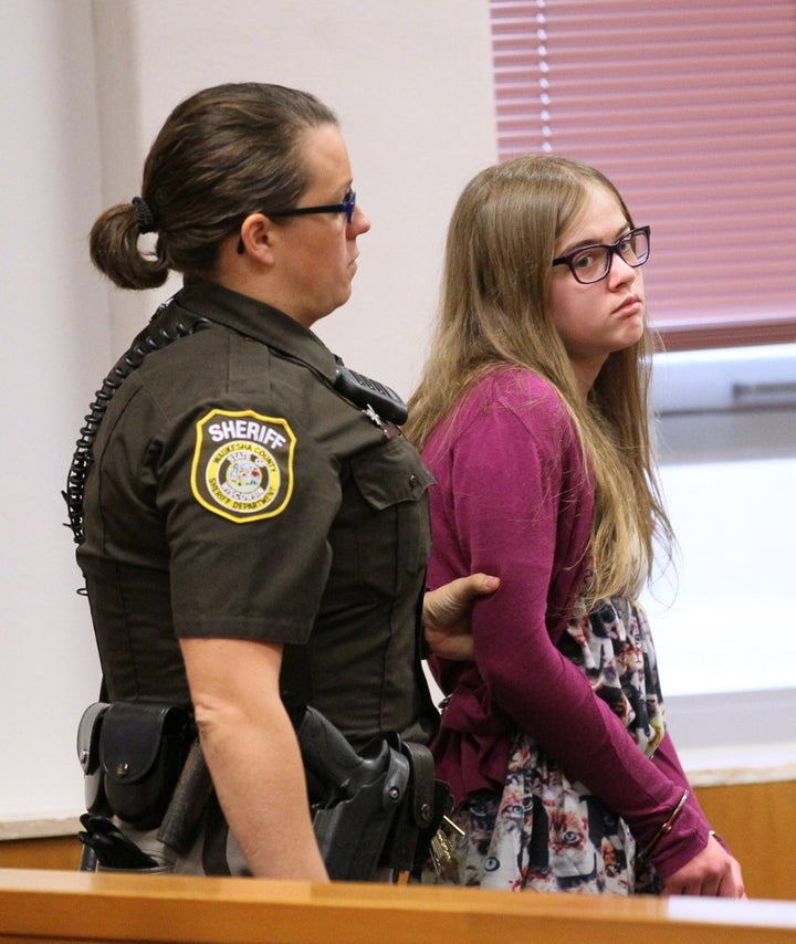 A sheriff's deputy brings Morgan Geyser into court on Aug. 21, 2015.