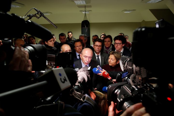 Collomb attends a news conference after meeting police following the brawl