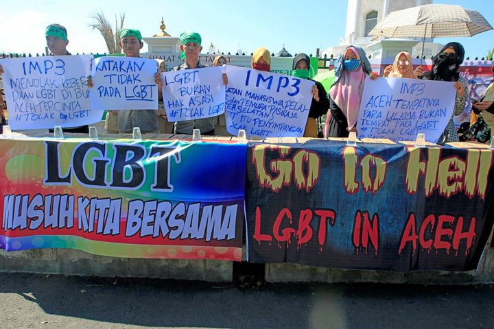Muslim protesters hold an anti-LGBTQ rally outside a mosque in Indonesia's Aceh province. 