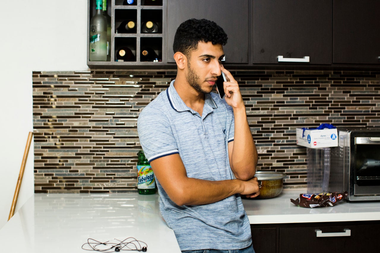 Jeancarlo Ruiz Núñez talks to his mother Mariluz.