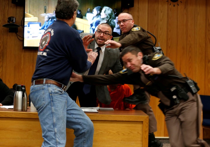 Randall Margraves (L) tried to attack Nassar in court on Feb. 2, 2018. All three of his daughters were sexually abused by Nassar under the guise of medical treatment.