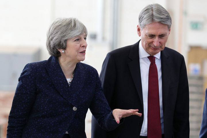 Theresa May must defy Chancellor Philip Hammond to deliver a 'clean Brexit', a leading Tory MP has said