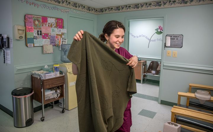 Lila, an abortion doula, gets a blanket for a patient in the recovery room at a Virginia abortion and family planning clinic in northern Virginia. Lila is part of D.C. Doulas for Choice, a volunteer-based collective that believes pregnant women need equal support if they decide not to become mothers. 