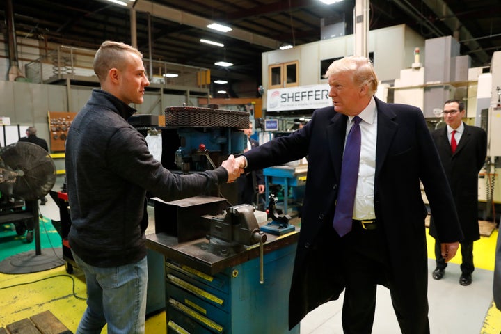 President Donald Trump greets a worker while touring Sheffer Corporation in Blue Ash outside Cincinnati, Ohio.