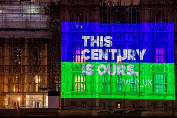 Slogans are projected onto the side of the Houses of Parliament by the Women's Equality Party to mark the centenary of the Representation of People Act.