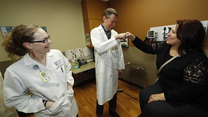 A Colorado primary care doctor congratulates a patient after her checkup. The Trump administration is shifting to states the responsibility for determining if health plans sold on the federal insurance exchanges have an adequate number of doctors.