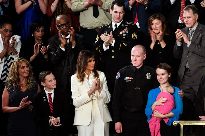 Ryan and Rebecca Holets, holding baby Hope, stood next to the first lady at the State of the Union address in January.