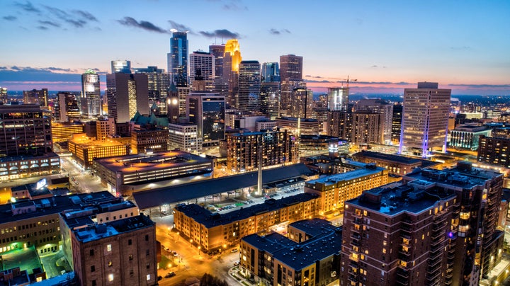 The downtown Minneapolis skyline at sunset.