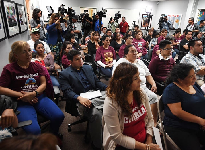 DACA recipients and supporters watch President Donald Trump during a State of the Union party at the Coalition for Humane Immigrant Rights and the California Dream Network offices in Los Angeles, Jan. 30, 2018.