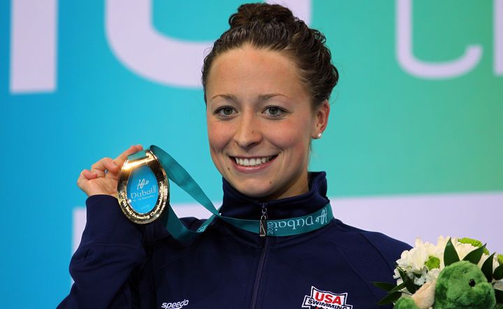 Ariana Kukors poses with her gold medal after winning the Women's 100-meter Individual Medley final of the 10th FINA World Swimming Championships in 2010 in Dubai, United Arab Emirates.