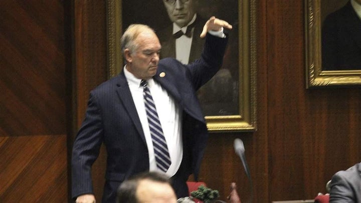 Arizona state Rep. Don Shooter, a Republican, drops his mic after voting no on a resolution that expelled him from the Legisl