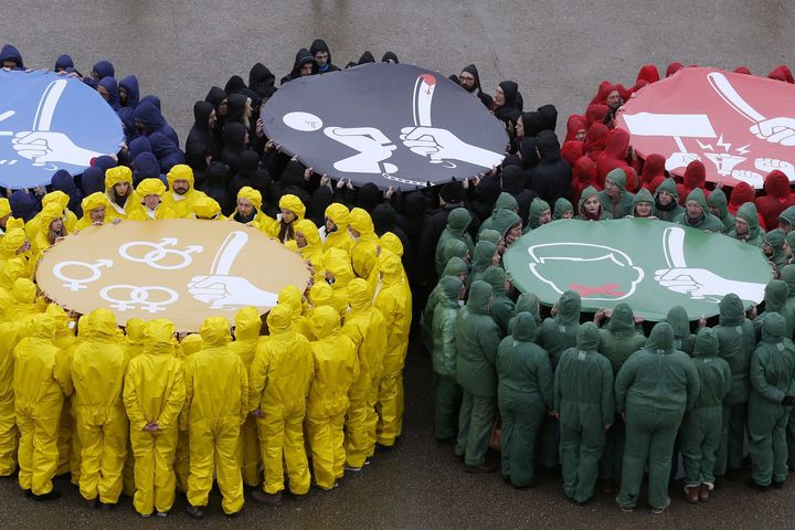 Activists of various NGOs gather in Paris to form the Olympics rings to protest against human rights violations in Russia ahead of the Sochi Winter Olympics.