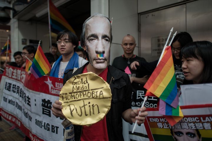An activist wearing a mask of Russian President Vladimir Putin joins protesters against Russia's anti-gay legislation on the day of the opening ceremony the Sochi Winter Olympic Games in Hong Kong on Feb. 7, 2014