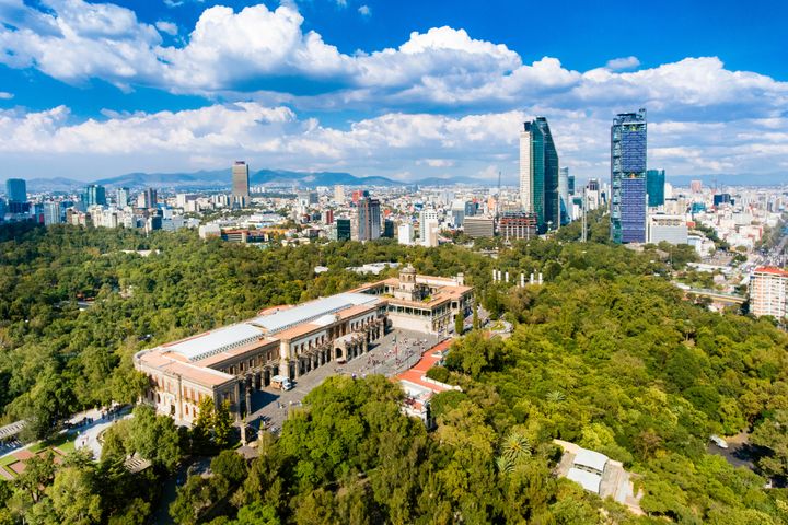 Chapultepec Castle with Mexico City's skyline in the background.