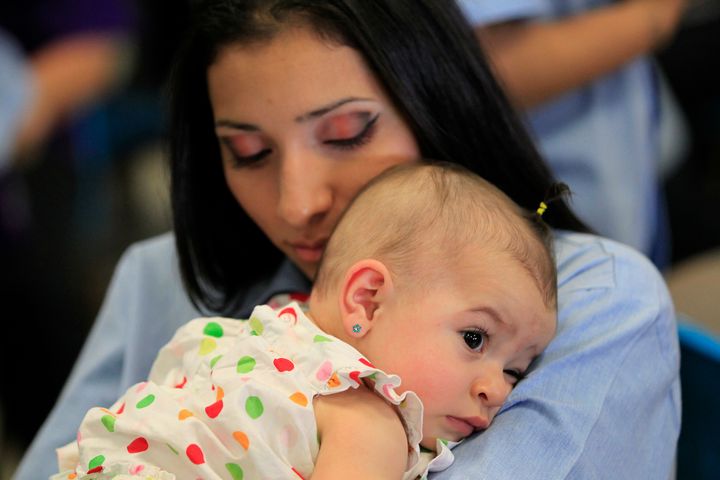A woman hugs her baby at the California Institution for Women state prison in Chino on May 5, 2012.
