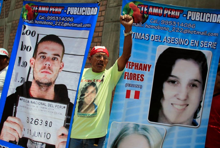 A man in Lima, Peru, holds posters of Dutch citizen Joran Van der Sloot and Peruvian girl Stephany Flores outside the Lurigancho prison, where van der Sloot was being read his sentence for murdering Flores in 2012. Van der Sloot was sentenced to 28 years in prison.