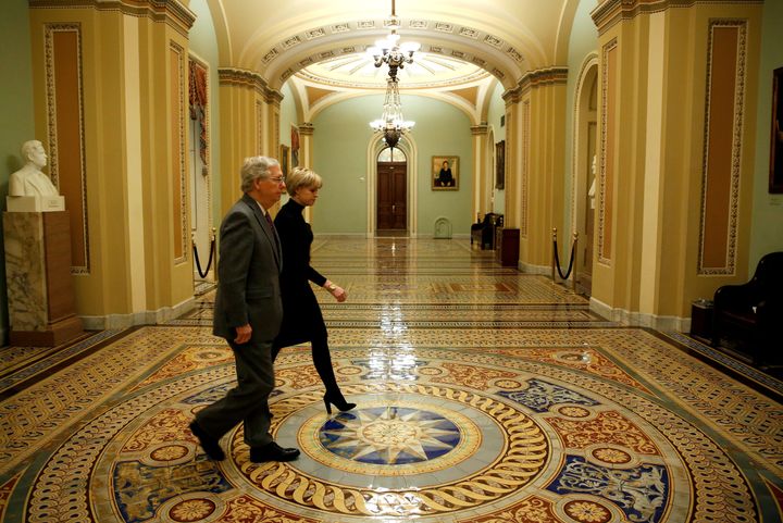 Senate Majority Leader Mitch McConnell (R-Ky.) walks to the Senate floor before a vote to end a government shutdown early Friday.