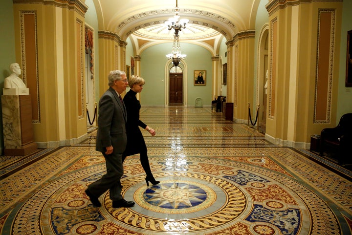 Senate Majority Leader Mitch McConnell (R-Ky.) walks to the Senate floor before a vote to end a government shutdown early Friday.