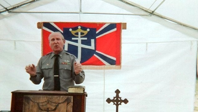 A photo from Arthur Jones' campaign website shows him speaking at the Aryan Nations 2014 World Congress in Converse, Louisiana. 