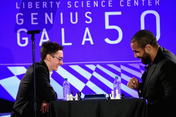 John Urschel faces Grandmaster Fabiano Caruana, one of the top 10 players in the world, at the Liberty Science Center's Genius Gala on May 20, 2016 in Jersey City, New Jersey.