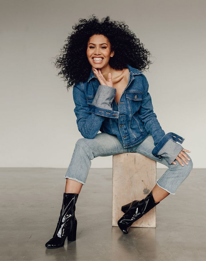 Y/Project Denim Jacket With Exaggerated Sleeves, $1,485, available at Farfetch; A.P.C. jeans; Kenneth Cole Alyssa Patent Leather Boot, $185, available at Kenneth Cole.