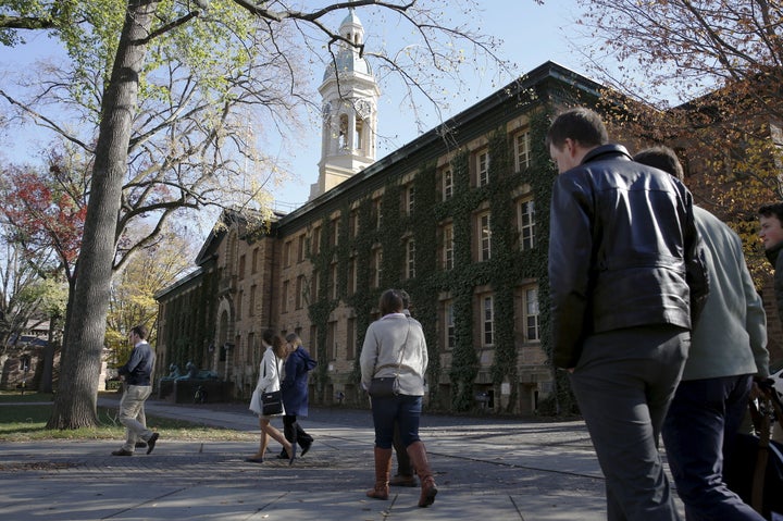 People walk past Princeton University's Nassau Hall in Princeton, New Jersey, on Nov. 20, 2015.