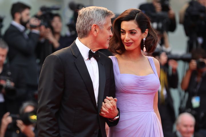 George and Amal Clooney walk the red carpet ahead of the