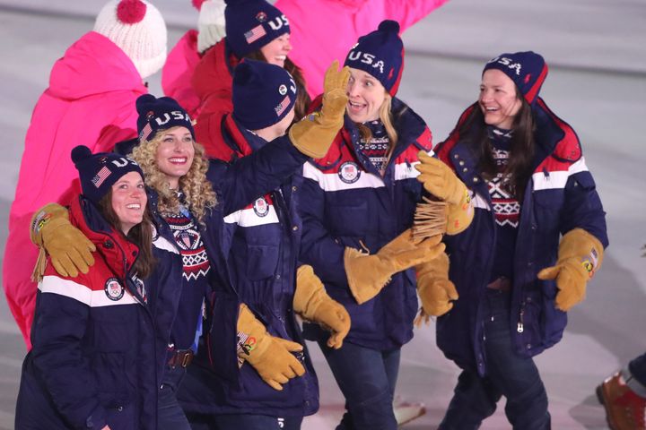 Team USA athletes sport the Polo Ralph Lauren gloves many people liken to those worn in the movie "Dumb and Dumber" during the opening ceremony of the XXIII Olympic Winter Games at Pyeongchang Olympic Stadium.