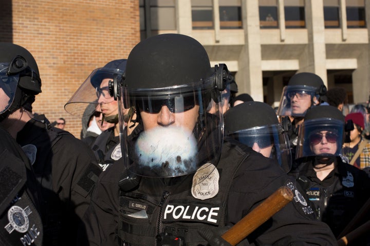 Seattle police move on counterprotesters Saturday at Red Square at the University of Washington.