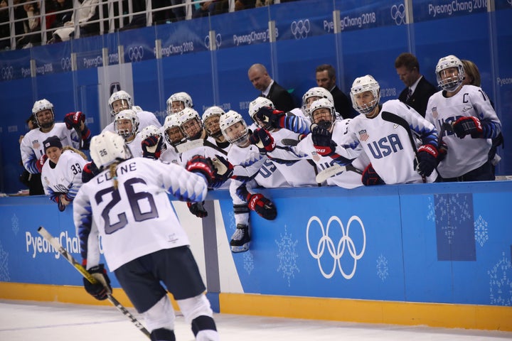 Kendall Coyne celebrates the go-ahead goal with teammates.