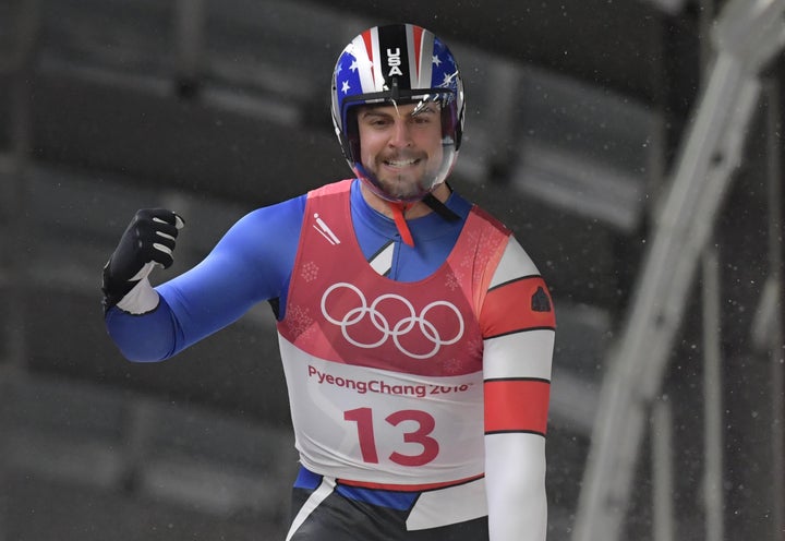 Chris Mazdzer celebrates after his final run.